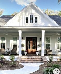 a white house with porch and front door