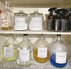 the shelves are filled with different types of liquid