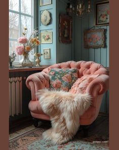 a pink chair sitting in front of a window