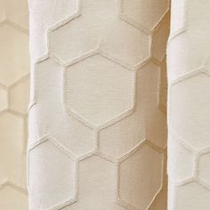 three different colored wallpapers with hexagonal shapes on them, one in white and the other in beige