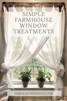 a window with white curtains and some potted plants