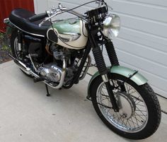 a motorcycle parked in front of a garage