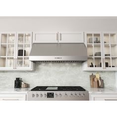 a stove top oven sitting inside of a kitchen next to white cabinets and counter tops