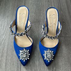 Rich Blue Satin Heels From Jessica Simpson Collection Accented With Jewels. Pointed Toe, Slide On Mule Style. Only Tried On Indoors, Never Worn Out. Excellent Condition. One Small Scuff To The Satin (Pictured). Barely Noticeable But Noted For Full Disclosure. Size 7.5/38 Glamorous Blue High Heel Wedding Shoes, Blue Wedding Shoes With 4-inch Heel, Blue Glamorous Wedding Shoes For Party, Blue Heels With Rhinestones And Round Toe, Blue Pointed Toe Heels With Rhinestones, Blue Rhinestone Pointed Toe Heels, Blue Pointed Toe Wedding Shoes For Party, Blue Satin Heels, Jessica Simpson Collection