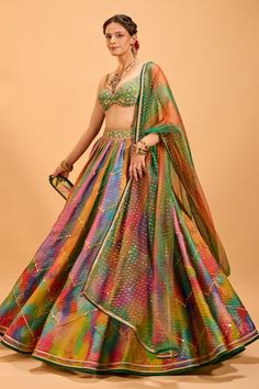 Multicolored attached cancan panelled lehenga with mirror embroidery. Paired with a floral embroidered padded blouse with a taselled hem and dupatta. - Aza Fashions Fusion Style Multicolor Sets For Navratri, Multicolor Navratri Sets, Multicolor Fusion Sets For Navratri, Fusion Style Choli With Zari Work For Festive Occasions, Fusion Style Festive Choli With Zari Work, Fusion Style Multicolor Choli For Navratri, Festive Fusion Choli With Zari Work, Festive Fusion Choli With Dupatta, Fusion Style Multicolor Sets With Cutdana