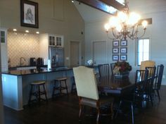 a dining room table and chairs in a kitchen