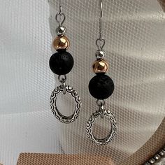 Ladies Dangle Beaded Earrings Featuring Graduated Beads In Stainless Steel, Rose Gold, And Lava Stone, And Finished With An Adorable Silver Plated Oval Charm Overall Length 2” Hypoallergenic Stainless Steel Ear Wires Lava Stone Is The Perfect Essential Oil Diffuser Just Add One Or Two Drops Of Your Favorite Essential Oil To The Lava Beads On Your Earrings For Aromatherapy! Lava Rock Is Known For Being A Grounding Stone, One That Can Balance The Emotions And Bring About Calmness And Strength New Handmade In My Atlanta Jewelry Studio Be Sure To Check Size Before Purchasing Please Let Me Know If You Have Any Questions Ready To Ship Note Colors May Be Slightly Different From Dangle Beaded Earrings, Jewelry Making Earrings, Lava Beads, Earrings Inspiration, Beaded Drop Earrings, Handmade Wire Jewelry, Lava Rock, Lava Stone, Bead Jewellery