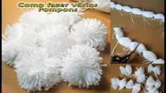 some white pompoms are on a table and one is being cut with scissors