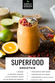 a recipe for superfood smoothie on a cutting board with sliced oranges and limes