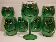 These hand painted 3D grinch wine glasses are super cute and add a little pop of fun to the holiday festivities.  Or maybe they're perfect for any time of year.  The classic Grinch grin is painted on the front of the glass, and the green shimmer is painted every else hung the 3D illusion.   Glass size/shape may vary slightly based on what I have in stock.  Please reach out with any questions. Christmas Glitter Glasses, Painted Wine Glasses Christmas, Custom Wine Glass, Wine Painting, Glass Painting Designs, Wine Glass Crafts, Wine Bottle Art, Painted Glasses, Hand Painted Wine Glasses