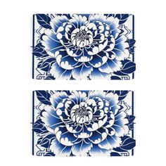 two blue and white tiles with floral designs on the sides, one is in the shape of a flower