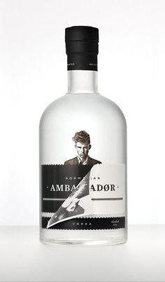 a bottle of amba ador vodka sitting on a table with a white background