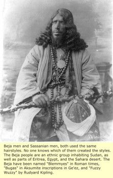 an old photo of a man with long hair and beads on his head, sitting in front of a wall