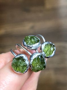 Handcrafted ring combines 925 sterling band with clear AAA+ quality green Peridot. Called “the extreme gem” by the Gemological Institute of America, Peridot is born of fire and brought to light, one of only two gems (Diamond is the other) formed not in the Earth’s crust, but in molten rock of the upper mantle and brought to the surface by the tremendous forces of earthquakes and volcanoes. Peridot has also been found (in its basic form called olivine) in meteorites, on Mars and the moon. Associa Molten Rock, Gem Diamonds, August Birthstone, Green Peridot, Handcrafted Rings, August Birth Stone, Rock Crystal, Clear Quartz, The Earth