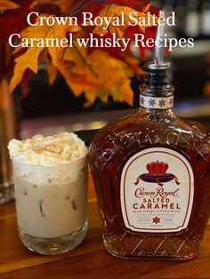 a bottle of crown royal salted caramel whisky next to a glass with whipped cream in it