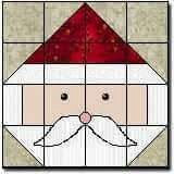 a quilted santa claus face with a red hat and moustache