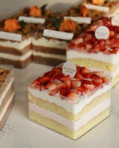 there are many different desserts on the table together, including strawberries and cake