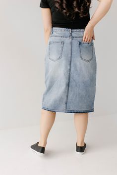 Vintage, versatile, and effortlessly cool - the knee-length 'Haven' denim skirt is the perfect addition to a modest wardrobe! The high waisted button front paired with a lightly distressed hem adds some classic character. Created with an A-line design, this skirt works well for a variety of body types. Tuck in a statement tee for an effortless retro vibe or add a simple white blouse for a modern but minimal style. 100% Cotton Machine Wash Cold Do Not Bleach Tumble Dry Low Heat Iron Low Heat Do N