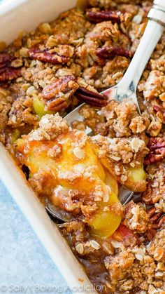 a casserole dish filled with fruit and nuts