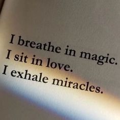 an open book with the words breathe in magic, sit in love, i exhale mirages