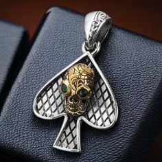 Embrace your edgy style with our sterling silver pendant featuring spades adorned with a skull motif, accented with luxurious 18K gold detailing. Crafted with meticulous attention to detail, this pendant exudes boldness and sophistication. The spade design adds a touch of mystery and intrigue, while the skull motif brings a rebellious edge to the piece. Enhanced with 18K gold accents, this pendant exudes opulence and luxury, creating a striking contrast against the sterling silver base. The intr Joker Jewelry, Goth Jewelry, Skull Pendant, Vintage Pendant, Gold Accent, Jewelry Vintage, Edgy Fashion, Statement Jewelry, Gold Accents