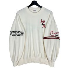 Vintage 90's Nike Just Do It Embroidery Sleeve Logo Sweatshirt White Cream Size M Made in USA  * Size on Tag : 100 * Manual Measurement (inch) : Chest (pit to pit) 24, Length 24, Shoulder 22, Sleeve 20.5, Hem 16. * Recommended for Size : Medium (M) * Measurement was taken lying flat without stretching. * Color : White Cream  * Condition : Other than STAINS, all in good vintage condition. * See photos for details. * Free Defect : No Holes, No Tears, No Faded. SW 3 / XX Nike Vintage Sweatshirt Creme, 90s Long Sleeve Tops With Embroidered Logo, 90s Crew Neck Top With Embroidered Logo, Vintage Crew Sweater With Embroidered Logo, 90s Style Winter Tops With Embroidered Logo, Retro Tops With Embroidered Logo For Fall, 90s Style Crew Neck Sweatshirt With Embroidered Graphics, Streetwear Long Sleeve Tops With Embroidered Logo, Retro White Crew Neck Sweater