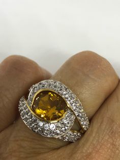 Golden citrine with white sapphire golden Sterling Filigree finished Setting Handmade 5.5 Can be resized your laser, my jeweler charges $10 All rings are shipped in a nice gift box. Check out our over a THOUSAND great reviews Engraving is $4 per letter and is not always perfect depending on the piece. It can take a few days if the jeweler is busy. This is payable to Paypal Judithsltd@gmail.com Yellow Diamond Gemstones For Anniversary, Gold Gemstones With Diamond Accents, Round Shape, Gold Brilliant Cut Gemstones As Gift, Gold Brilliant Cut Gemstones For Gift, Round Gemstones With Diamond Accents For Gifts, Yellow Gemstone With Center Stone As Gift, Brilliant Cut Gold Gemstones For Gifts, Yellow Gemstones With Center Stone For Gifts, Yellow Diamond Gemstones For Gift