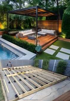 an outdoor living area with a pool and deck