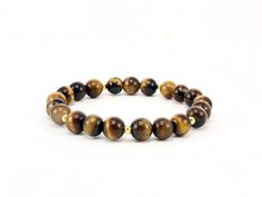 Tiger Eye: * Protective * Strength * Balance * Holds energy from the sun * Balance * Self Confidence * Recommended for those beginning their spiritual journey * Encourages a positive attitude * Luck * Clear thinking and insight * Awareness W A R N I N G: *Small parts/beads may be considered a choking hazard. Keep out of reach of children. I am not a doctor. Stones/healing jewelry should be worn/used along with medical/mental health professionals and their services when needed. Crystals simply pr Everyday Round Spiritual Bracelets, Everyday Spiritual Round Bracelets, Spiritual Round Bracelets For Everyday, Brown Spiritual Bracelets For Meditation, Spiritual Brown Bracelet For Meditation, Spiritual Hypoallergenic Round Bracelets, Spiritual Hypoallergenic Bracelets, Brown Hypoallergenic Spiritual Jewelry, Spiritual Brown Hypoallergenic Jewelry