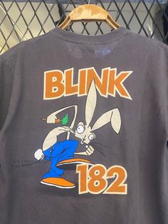 a gray shirt with an image of a rabbit on it