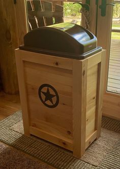 a large wooden box with a star on the lid sitting in front of a door