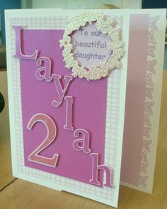 a pink and white birthday card with the words lay it at 2h on it