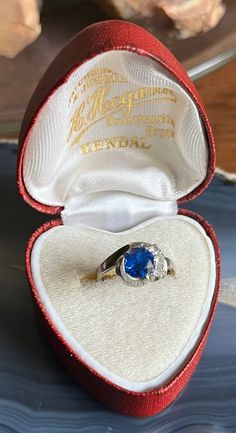 Item: Vintage 10K White Gold Sapphire Blue Iolite Ladies Ring. This is stamped 10K. The blue and white stones are all testing as Iolite using a Presidium Gemstone tester. The ring box shown in the photos is not included in the sale of the ring. Measurements: Size 4.5. It weighs 2.74 grams. Condition: Vintage, previously owned. Under magnification I can see a couple of tiny pin prick sized nicks and scratches on the blue stone. Nothing major. There may be other very minor signs of age/use. Vintage Blue Gemstone Birthstone Ring, Blue Birthstone Ring Stamped 14k As Gift, Blue Heirloom Birthstone Ring, Blue Heirloom-style Birthstone Ring, Blue Sapphire Ring Stamped 14k For Gift, Hallmarked Sapphire Birthstone Ring Gift, Blue Hallmarked Birthstone Ring Gift, Blue Sapphire Ring Stamped 14k, Vintage Sapphire Ring As A Gift