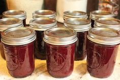 many jars are lined up on a table