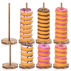 four stacks of donuts with pink and white frosting on them, each stacked up