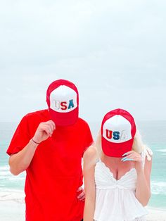 The USA Red Hat from Sassy Shortcake is a Red trucker style mesh hat with a white front and glitter USA text in the center. One size fits most. Red Summer Baseball Cap, Fun Red Trucker Hat With Letter Print, Red Baseball Cap Trucker Hat For Summer, Red Baseball Cap For 4th Of July, Summer Red Baseball Cap With Letter Print, Red Snapback Trucker Hat For Summer, Red Baseball Cap Trucker Hat For 4th Of July, Red Trucker Hat For 4th Of July, Red Snapback Hat With Curved Bill For Summer