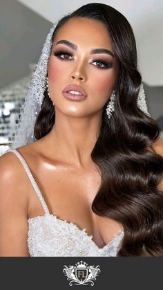 a woman with long brown hair wearing a wedding dress