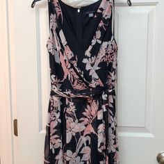 Navy Blue With Pink And White Flower Tommy Hilfiger Dress. Size 6. Dress Has A V/Faux Wrap Style Neckline, Slight Hi-Lo Style Bottom, With A Tie At The Waist. Brand New With Tags, Never Worn. Originally Paid $129. Nonsmoking Household Summer A-line Tommy Hilfiger Dress, Blue Sleeveless Tommy Hilfiger Dress, Tommy Hilfiger Blue Sleeveless Dress, Tommy Hilfiger Pink Spring Dresses, Chic A-line Tommy Hilfiger Dress, Tommy Hilfiger A-line Summer Dresses, Chic Tommy Hilfiger A-line Dress, Chic Summer Dresses By Tommy Hilfiger, Chic Tommy Hilfiger Summer Dresses