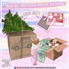 an image of a box of holiday decorations with a baby in it and a christmas tree on top