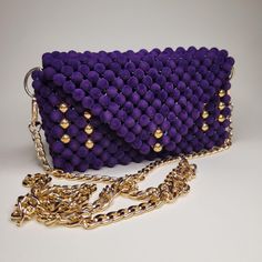 Embrace the charm of the Purple Heart Bag, crafted from deep purple velvet beads and lined with premium fabric. This handmade piece exudes elegance and warmth, making it the perfect accessory to add a touch of luxury to your style. Chic Purple Evening Bag As Gift, Chic Purple Evening Bag For Gift, Luxury Purple Shoulder Bag For Party, Chic Purple Shoulder Bag For Party, Luxury Purple Party Shoulder Bag, Elegant Purple Evening Bag, Elegant Purple Clutch For Everyday Use, Luxury Purple Clutch For Evening, Elegant Purple Shoulder Bag For Party