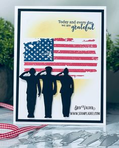 an american flag and two silhouettes on a card