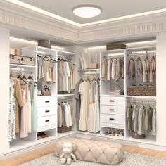 a white closet filled with lots of clothes