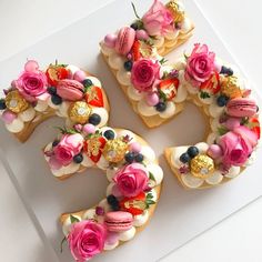 the number six is made out of cookies with frosting and flowers on them,