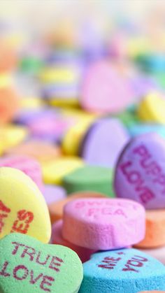 conversation hearts with the words true love written on them