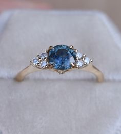 SKY BLUE MONTANA SAPPHIRE RING Once upon a time, the ancient Persians thought sapphires were so special, they believed that the earth had been created on top of the biggest blue sapphire ever, and that's why the sky was blue... It gives so romantic meaning for a blue sapphire engagement ring. One one represents a blue sapphire rig with diamonds to her or his beloved, it's considered representative of sincerity and faithfulness. This nature inspired floral design engagements ring features magic t Heirloom Blue Sapphire Diamond Ring, Blue Celestial Sapphire Promise Ring, Celestial Blue Sapphire Promise Ring, Heirloom Blue Sapphire Ring With Center Stone, Timeless Blue Sapphire Ring, Celestial Blue Sapphire Ring, Blue Celestial Ring With Center Stone, Celestial Blue Rings With Accent Stones, Blue Celestial Rings With Accent Stones