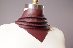 This scarf bandana is handmade from genuine beautiful soft thick leather. It has a twisted design. Mermaid Tale leather and burgundy are thicker hard leather, the other colors are softer leather. The straps are made from leather as well. One size fits most S/M/L If you want another color, just let me know I'll make a custom order for you which would take 2 weeks. This scarf bandana is one of a kind unisex leather bandana. I have other leather scarfs and chokers. Check out my shop! See more Acces Scarf Choker, Leather Scarf, Hot Clothes, Leather Choker Necklace, Scarf Bandana, Mermaid Tale, Beautiful Belts, Leather Chokers, Leather Shops