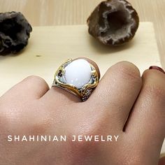 Handmade silver and gold plated ring with natural white stone agate. This is a perfect gift idea for mother, sister, and fish, sea animal lover) All our jewelry is made of high-quality sterling silver and has a stamp of 925 ▶RING SIZE: any size available (choose from the option) ▶RING WEIGHT: 11.2 gr ▶EARRINGS WEIGHT: 19.9 gr ▶EARRINGS LENGTH: 59 mm 1 inch = 25.4 mm 1 pound = 453.6 grams ⦿ Attention: The color of the stones may differ due to a difference between monitors ◦* ◦* ◦* ◦* ◦* ◦* ◦* ◦* White Natural Stones Jewelry For Promise Ring, Gift White Opal Gemstone Ring, White Natural Stones Promise Ring, White Gemstone Jewelry For Gifts, White Opal Ring Gift, Unique White Moonstone Ring, White Natural Stone Promise Ring, Elegant White Rings As A Gift For Her, Chalcedony Rings Fine Jewelry For Gift