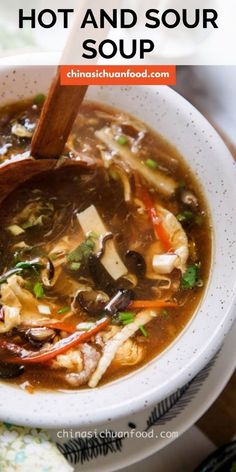 a white bowl filled with hot and sour soup