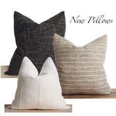 three pillows are sitting on a shelf with the words new pillows written in black and white