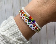 Rainbow Heart Beads Jewelry, Trendy Jewelry For Pride Gifts, Trendy Rainbow Jewelry For Friendship, Trendy Rainbow Jewelry For Pride, Adjustable Rainbow Friendship Bracelets For Birthday, Adjustable Rainbow Friendship Bracelets With Letter Beads, Handmade Adjustable Rainbow Jewelry, Adjustable Rainbow Jewelry For Everyday, Multicolor Bracelets For Pride